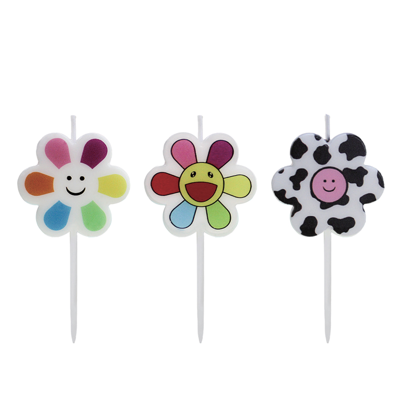 Lilin bermotif warna wajah tersenyum bunga